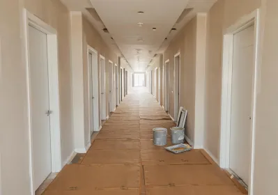 Multifamily corridor with floor protection boards