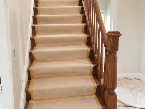 Hardwood stairs covered during remodel